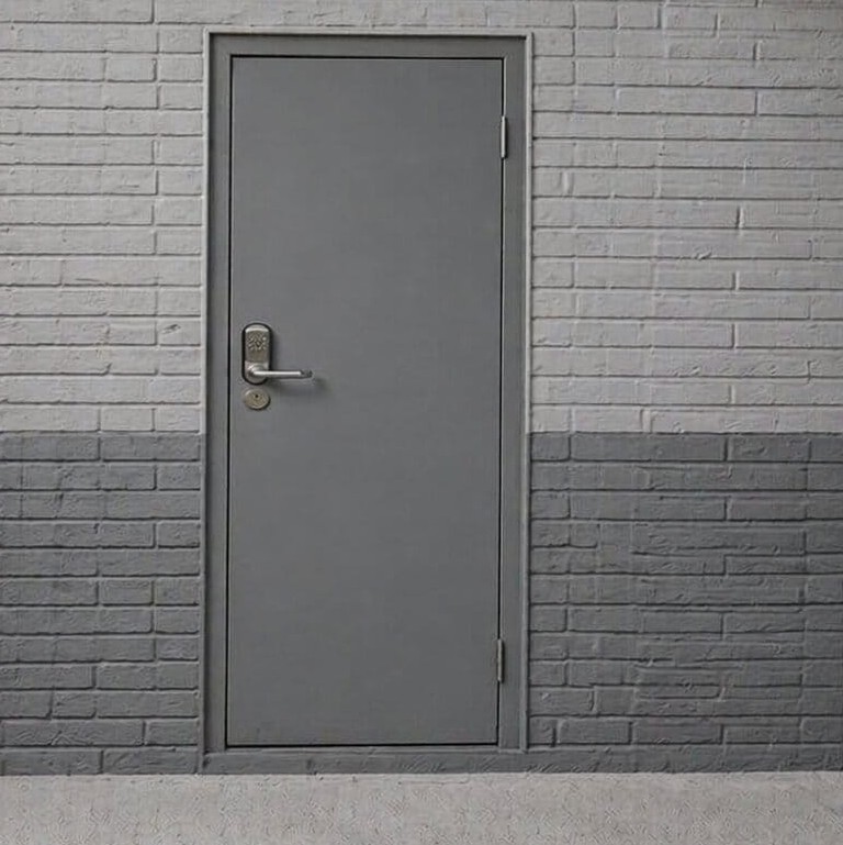 Close-up of anti-jemmy technology and dog-bolted hinges on a heavy-duty steel security door.