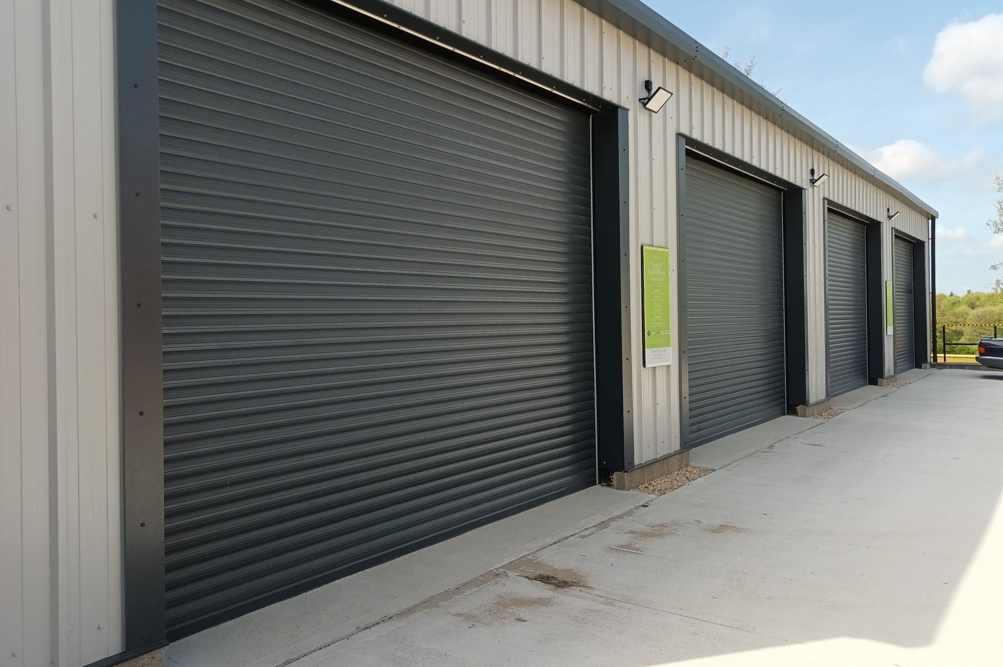 team and expertise Entrad installer fitting a bespoke steel security door on site in the UK.