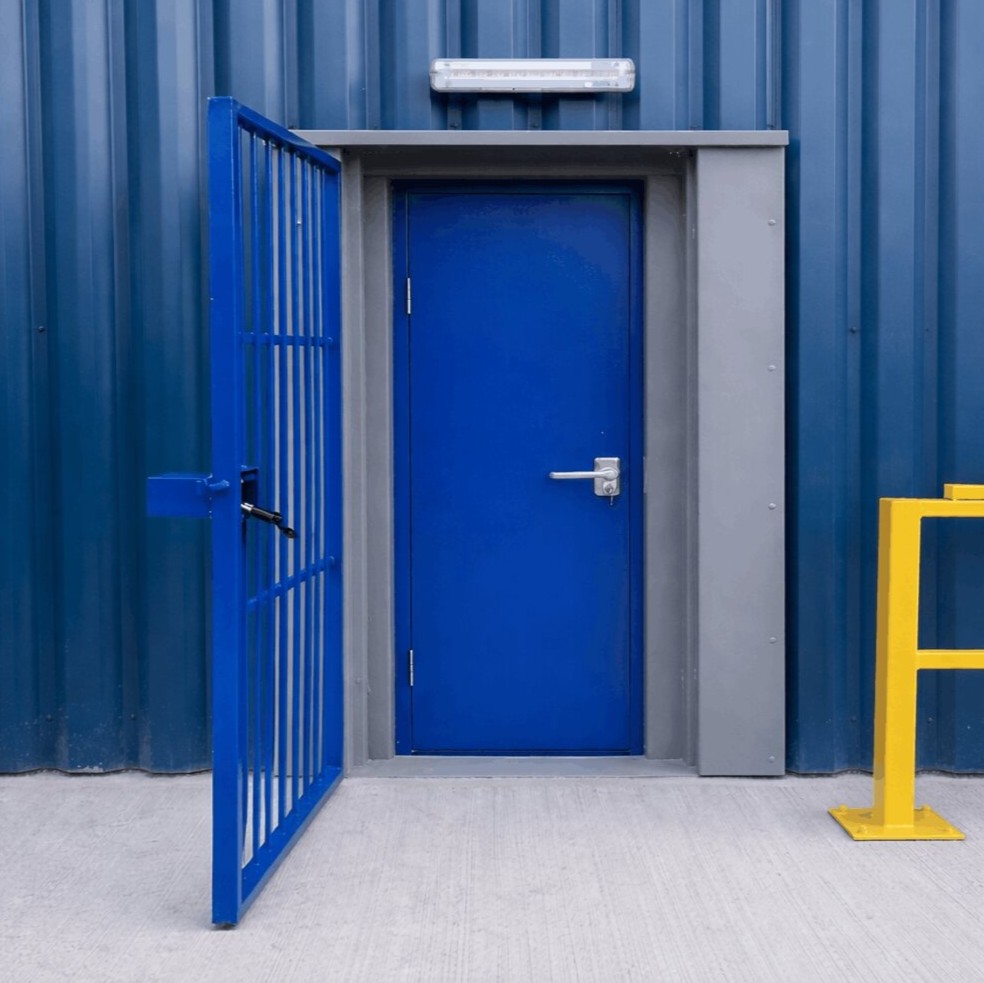 A technician using a laser distance meter and tape measure on an industrial steel door frame, with a digital measurement overlay.