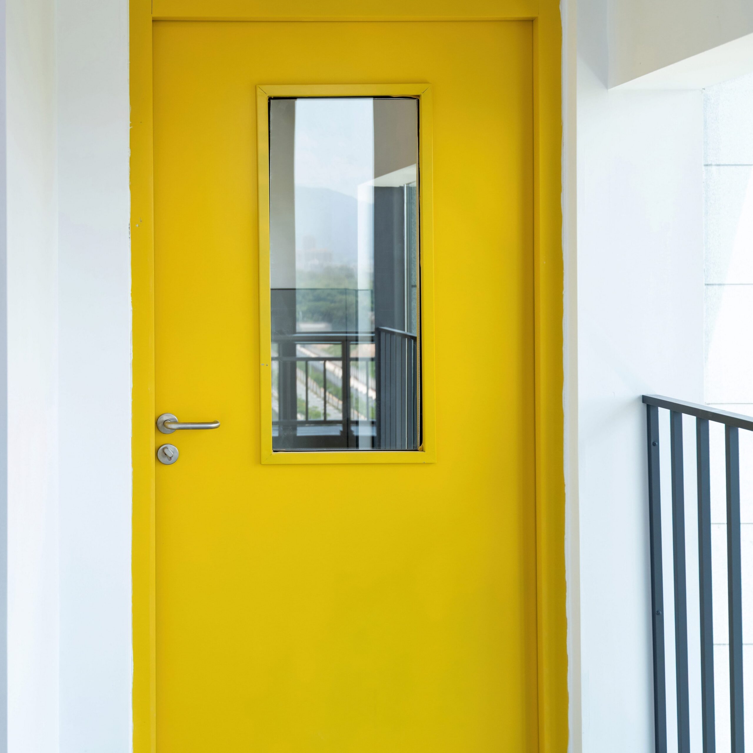 Securing Educational Assets and Ensuring Student Safety 3 Entrad installation team fitting a bespoke steel security door at a commercial site in the UK.