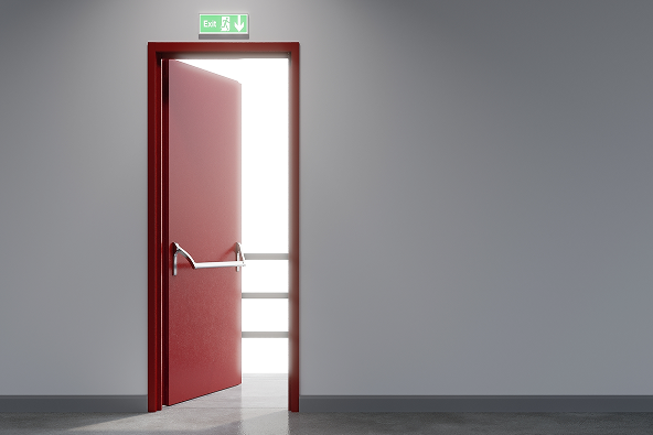 Securing the UK’s Infrastructure Two Entrad installation technicians in high-vis vests use precision tools and a laser level to fit a custom-made security steel door.