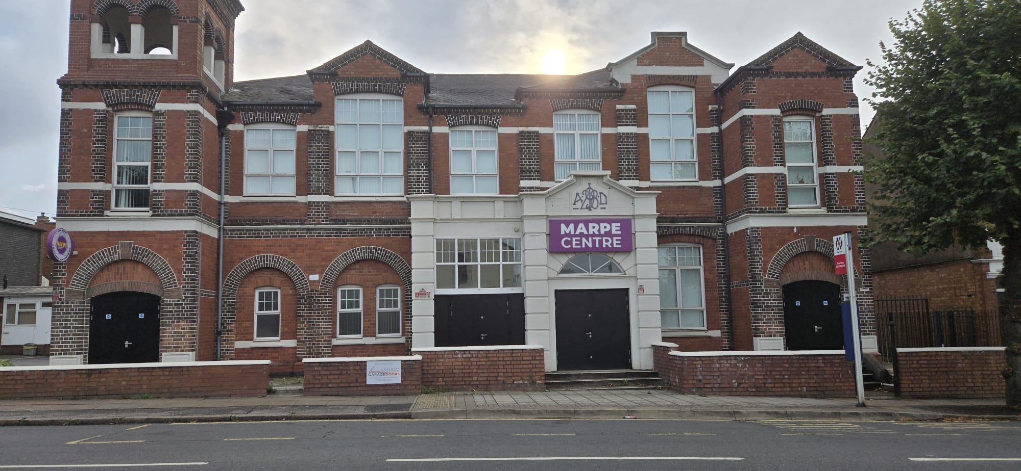 The Marpe Centre, a historic red-brick church in Coventry, fitted with black steel security doorsets by Entrad